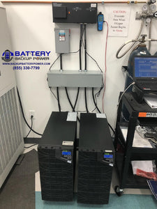 (2) 6KVA 10KVA BBP UPS Running Wired In Parallel N+1 With Connection Sync Box Providing Critical Emergency Backup Power To Facility Plus Voltage Regulation, Frequency Correction, And Power Conditioning To Electrical Sub Panel - Dual UPS View